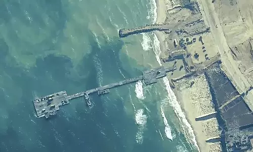 UN food agency pauses its aid work at US pier in Gaza over security concerns in latest setback