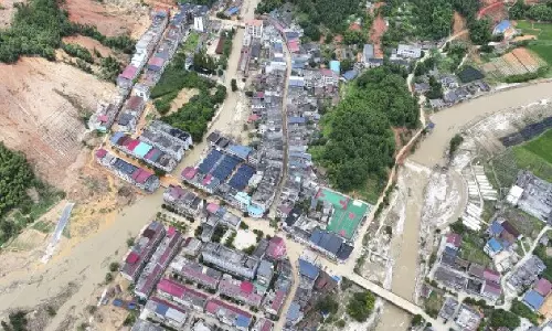 Death toll jumps to 30, with 35 others missing, in an area hit by heavy rains in southeastern China