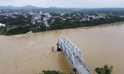 Bridge collapses as more rain falls in Vietnam & storm deaths rise to 21