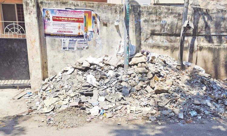 Construction debris on Demonte Road irks Santhome commuters