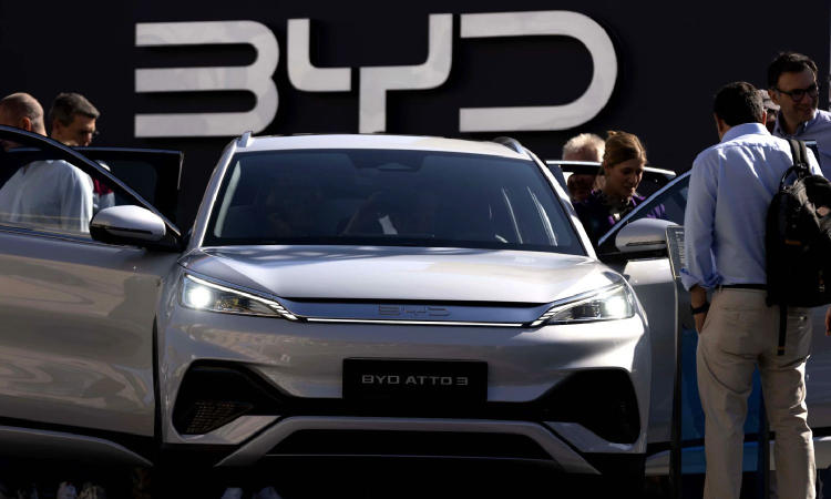 Chinese electric vehicle maker BYD reports 2024 revenue over USD 100B topping Teslas sales Chinese electric vehicle maker BYD reports 2024 revenue over USD 100B topping Teslas sales