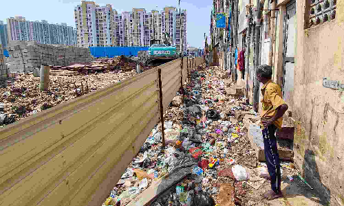 Lack of waste management turns backside of TNUHDB flats in North Chennai into dumping grounds
