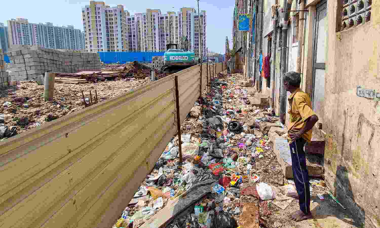 Lack of waste management turns backside of TNUHDB flats in North Chennai into dumping grounds