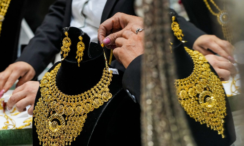Gold halts record rally, drops Rs 2,400 to Rs 99,200/10 g amid easing US-China tensions