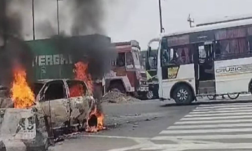 Car crashes into median near Poonamallee, goes up in flames