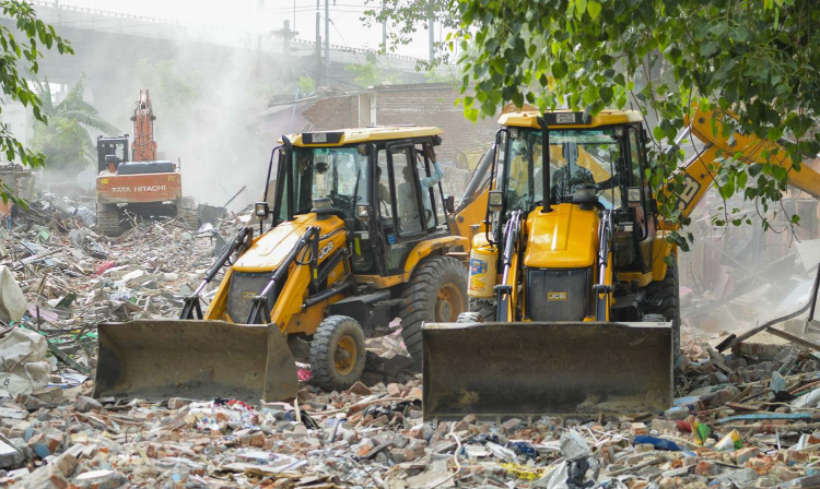 Residents watch their decades-old homes razed during demolition drive in Delhis Madrasi Camp