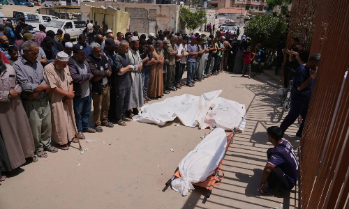 Israeli forces open fire a kilometer away from Gaza aid site, killing 3, health officials say