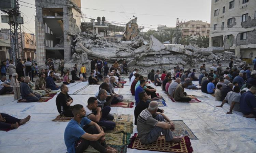 Gaza marks start of Eid with outdoor prayers amongst rubble with food growing ever scarcer