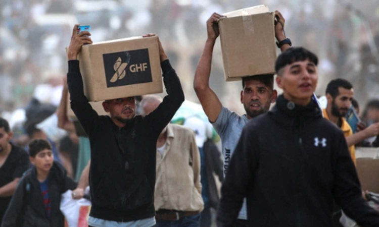 Palestinians say 5 killed by Israeli fire near aid sites. Israel says it fired warning shots