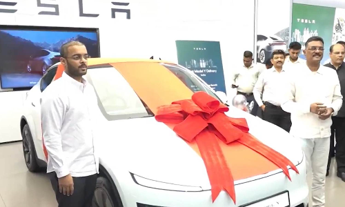 Minister buys Teslas first car from Mumbai showroom, claims wants to teach grandson about green mobility Minister buys Teslas first car from Mumbai showroom, claims wants to teach grandson about green mobility