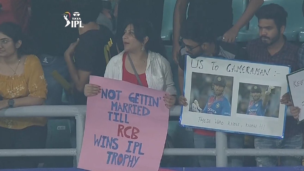 RCB fan holds placard saying wont marry until team wins goes viral