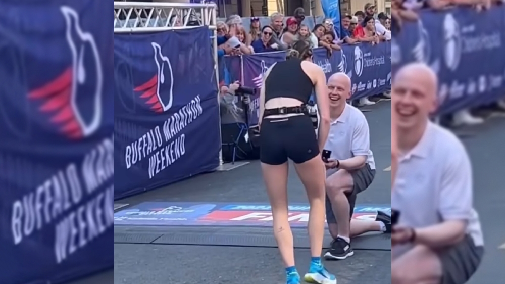 Man proposes to girlfriend at finish line of marathon Man proposes to girlfriend at finish line of marathon