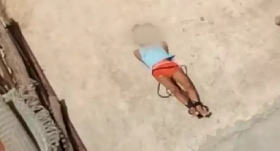 Video of 5-yr-old lying on terrace with hands, legs tied surfaces