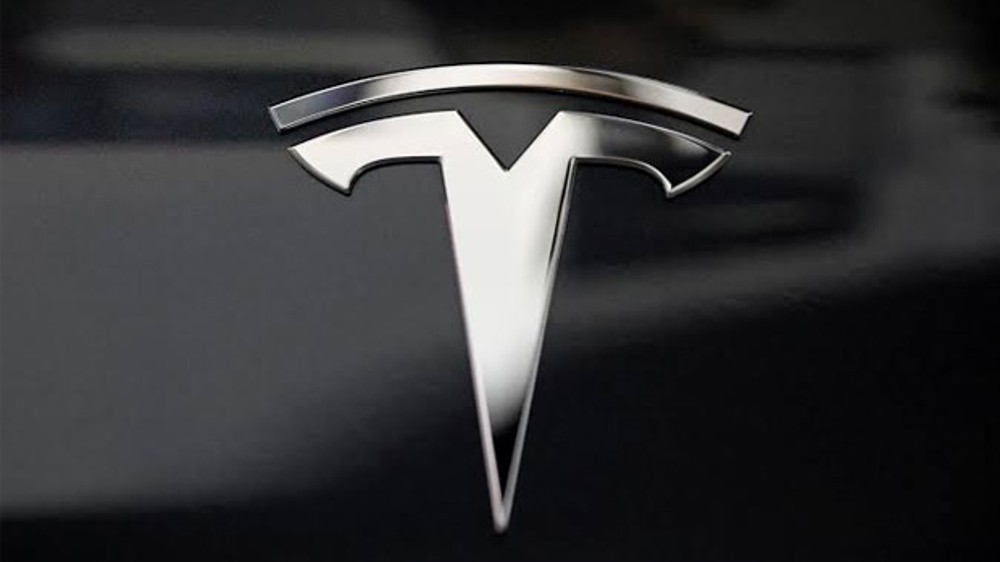Anticipating US downturn, Tesla boss details staff cuts