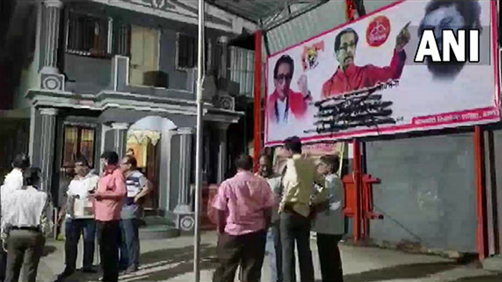 Eknath Shindes supporters blacken posters of Uddhav Thackeray Eknath Shindes supporters blacken posters of Uddhav Thackeray