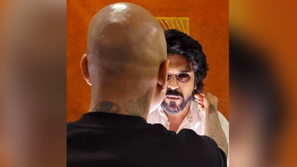 Candid video of Ram Charan flaunting his new hairstyle goes viral Candid video of Ram Charan flaunting his new hairstyle goes viral