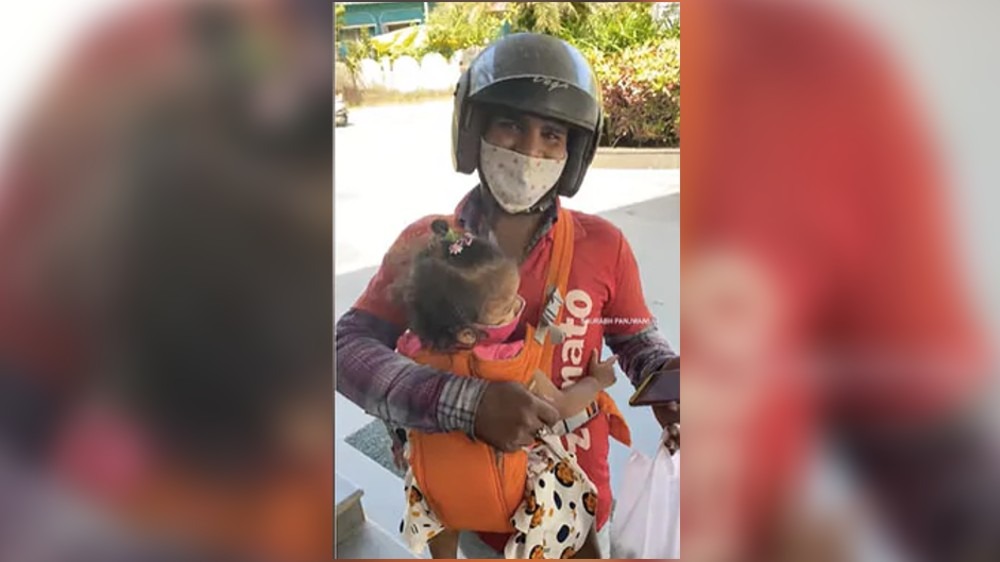 Video of Zomato delivery executive carrying kids to work wins heart Video of Zomato delivery executive carrying kids to work wins heart