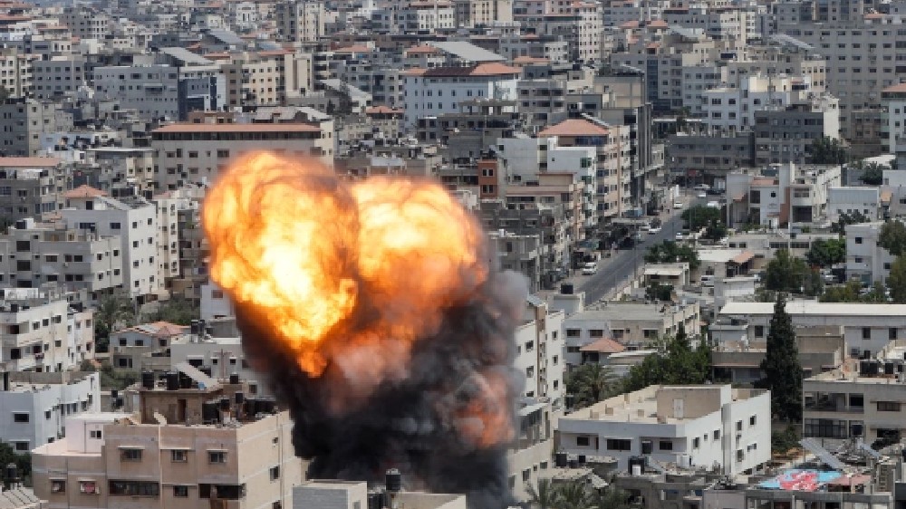 Palestinians sift through rubble at Gaza camp hit in Israeli strike