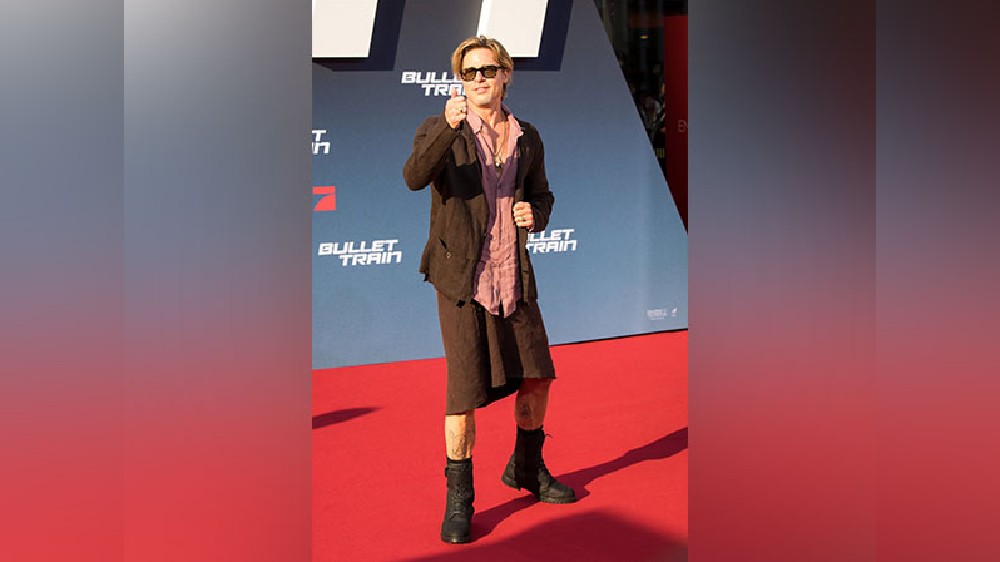 Brad reacts to his viral skirt look from Bullet Train premiere