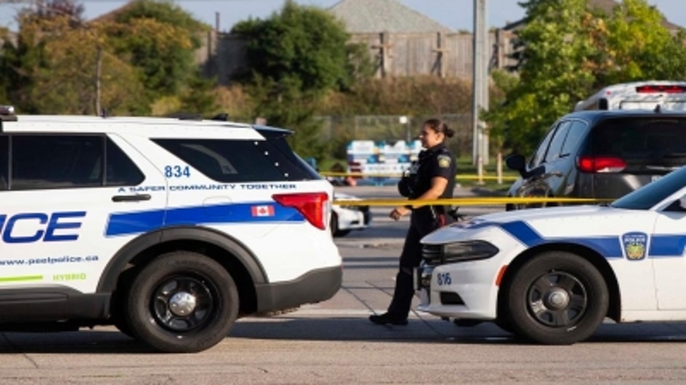 Canadian police officer shot dead, suspect in custody