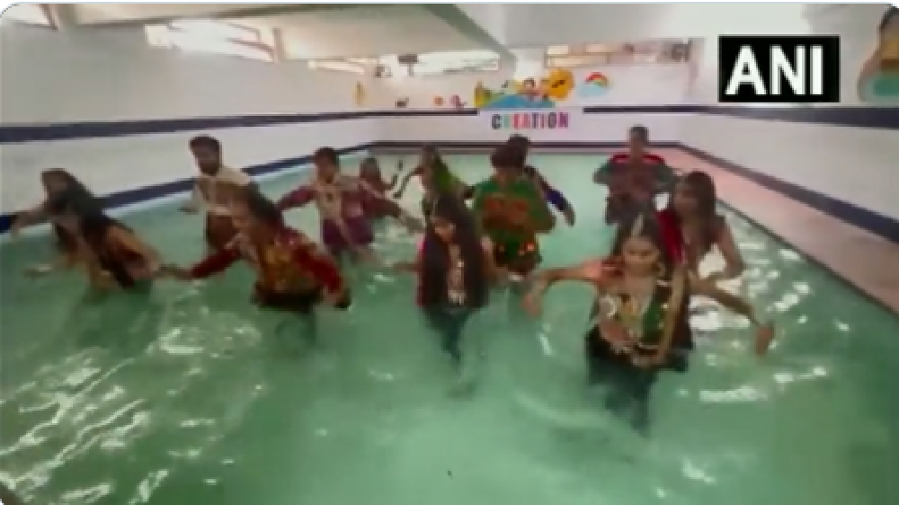 Garba with a twist: People in Udaipur perform Garba in swimming pool Garba with a twist: People in Udaipur perform Garba in swimming pool