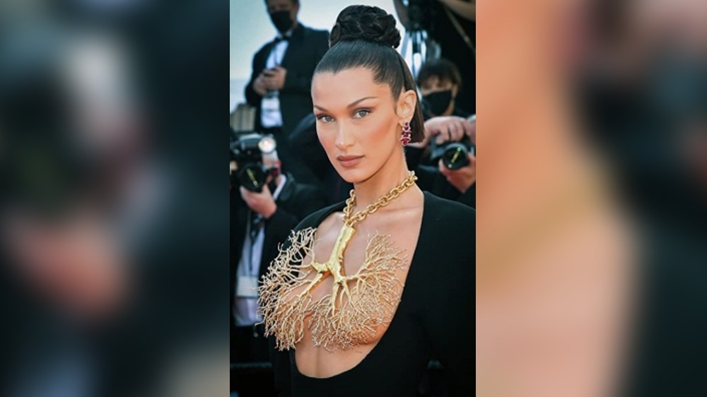 Topless Bella Hadid gets spray-on dress on runway