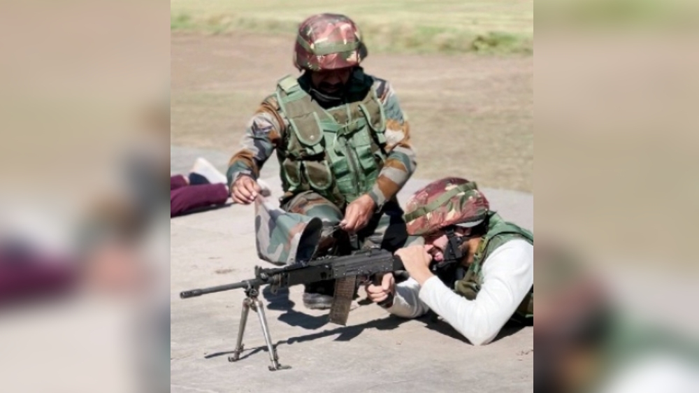 Vijay Deverakonda shoots with a rifle along with a jawan