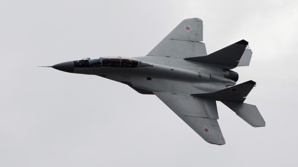 Russian warplane falls on building in Siberia, 2 pilots die