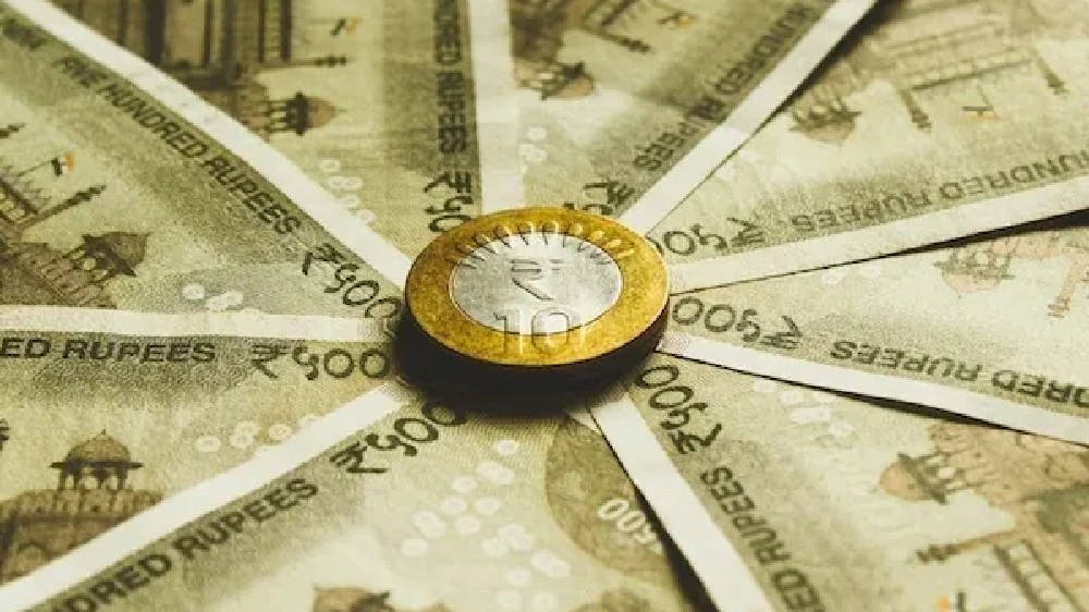 Rupee touches record low of 83.18 before closing against dollar