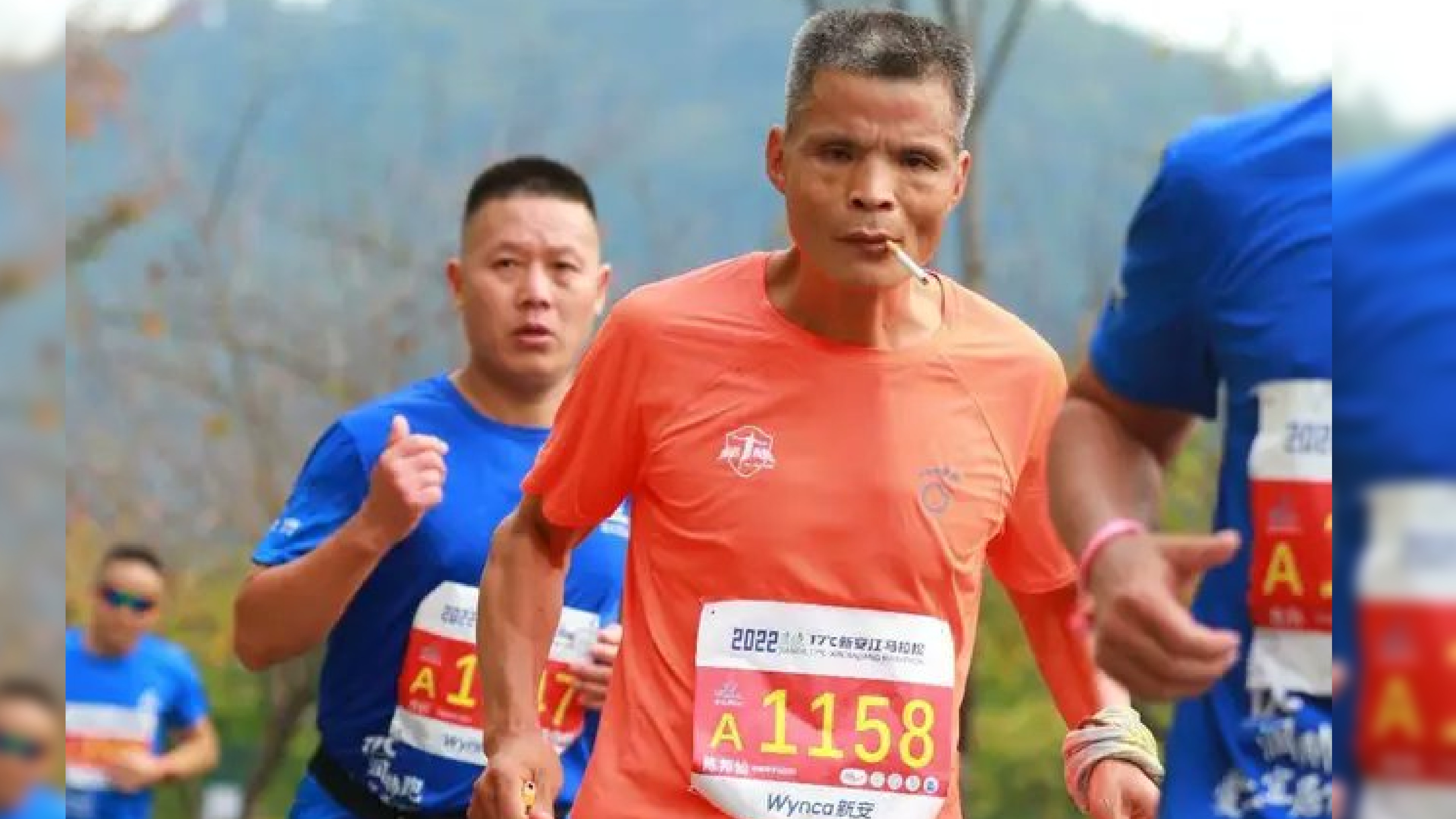 Chinese grandpa finishes marathon while chain-smoking cigarettes Chinese grandpa finishes marathon while chain-smoking cigarettes
