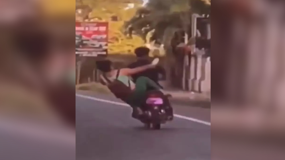 ‘Karma is a boomerang’: Woman falls on trying to kick a bike ‘Karma is a boomerang’: Woman falls on trying to kick a bike