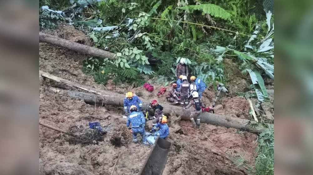 Search resumes for 12 missing in Malaysia landslide