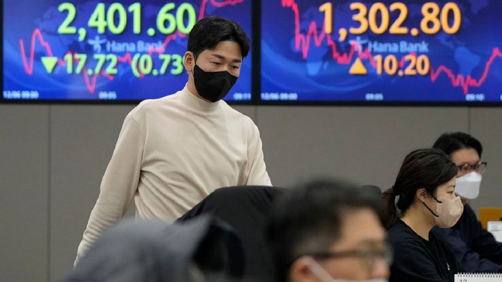 Asian shares lower as strong data hit hopes for dovish Fed