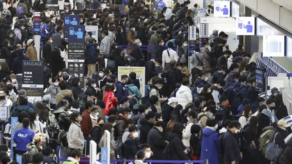 Japan tests all China arrivals for Covid amid surging cases