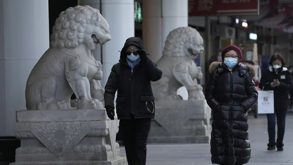 China faces bumpy road to normal as infections surge