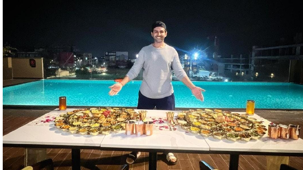 Foodie Kartik Aaryan poses with massive Gujarati thalis