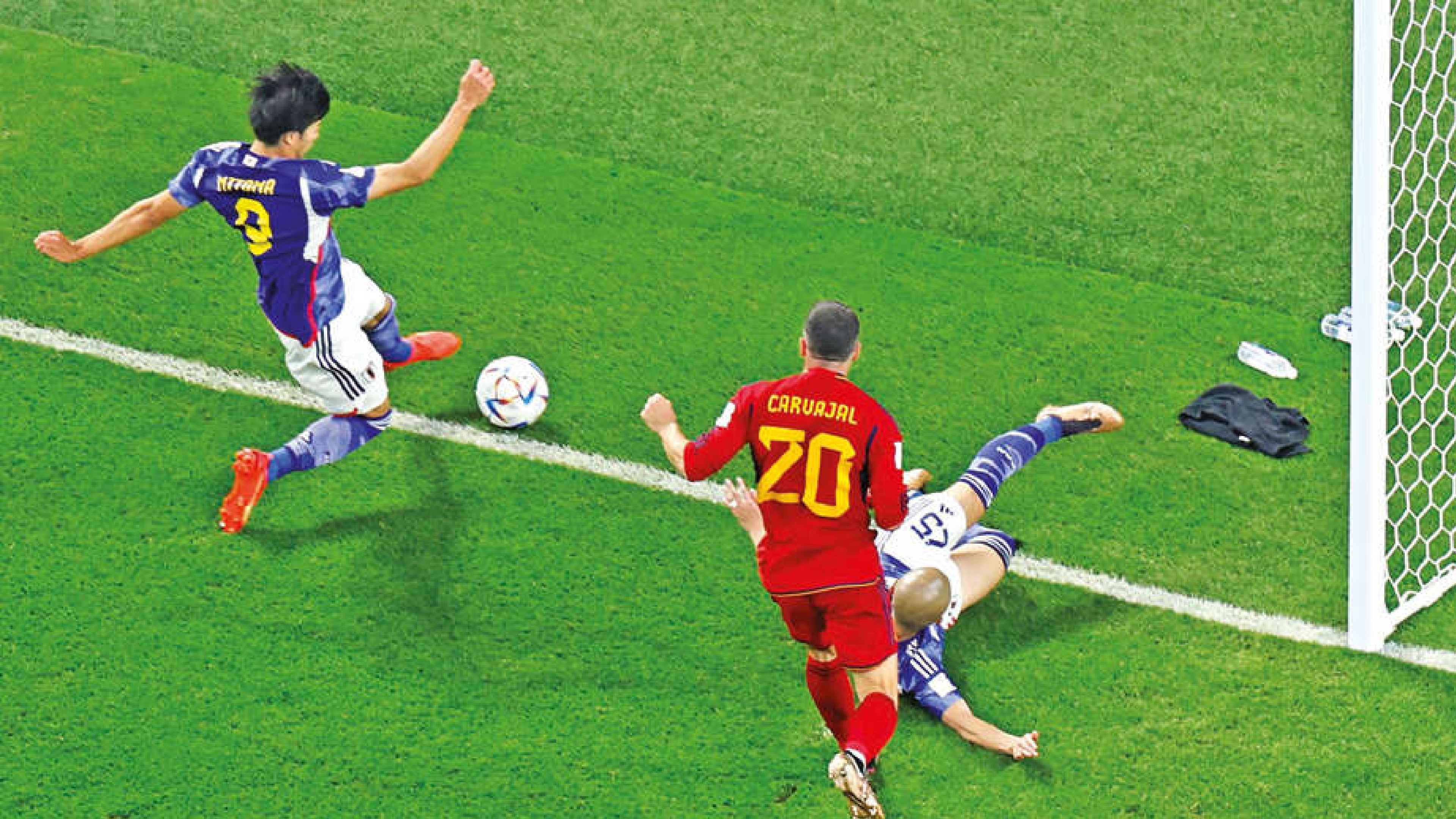 Japan tops group with comeback win over Spain