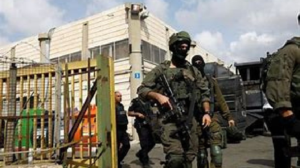 Israeli military kills Palestinian teacher, militant in raid