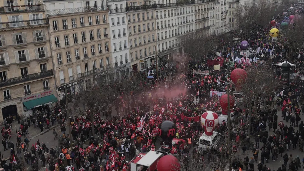 Macron vows to proceed with pension reform, despite protests