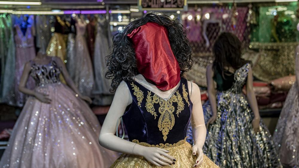 Kabuls mannequins, hooded and masked under Taliban rules