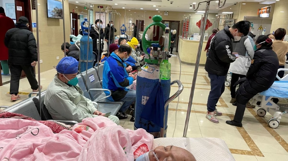 China says Covid outbreak has infected 80% of population