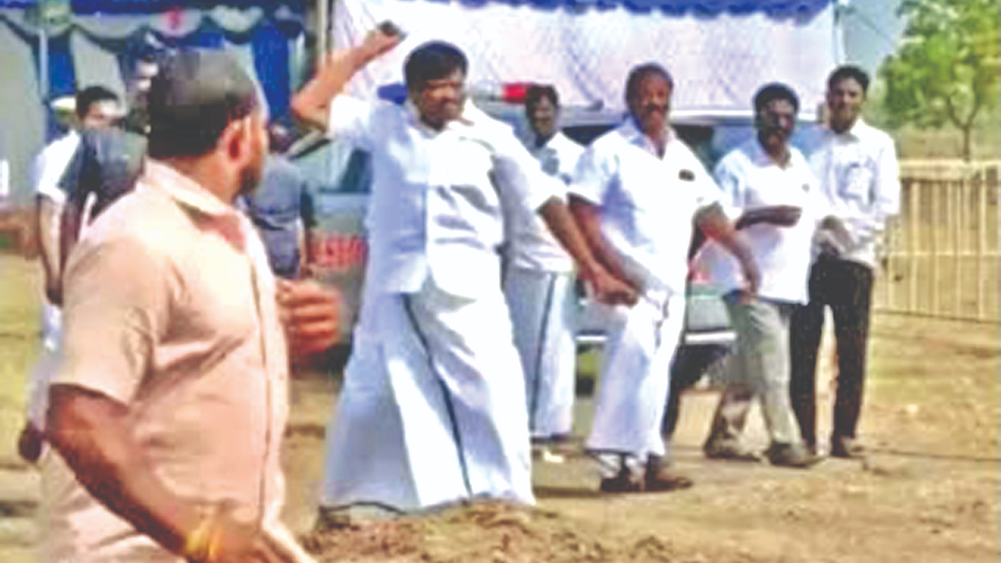 Min Nasar throws stone at party worker for delay in bringing him chair
