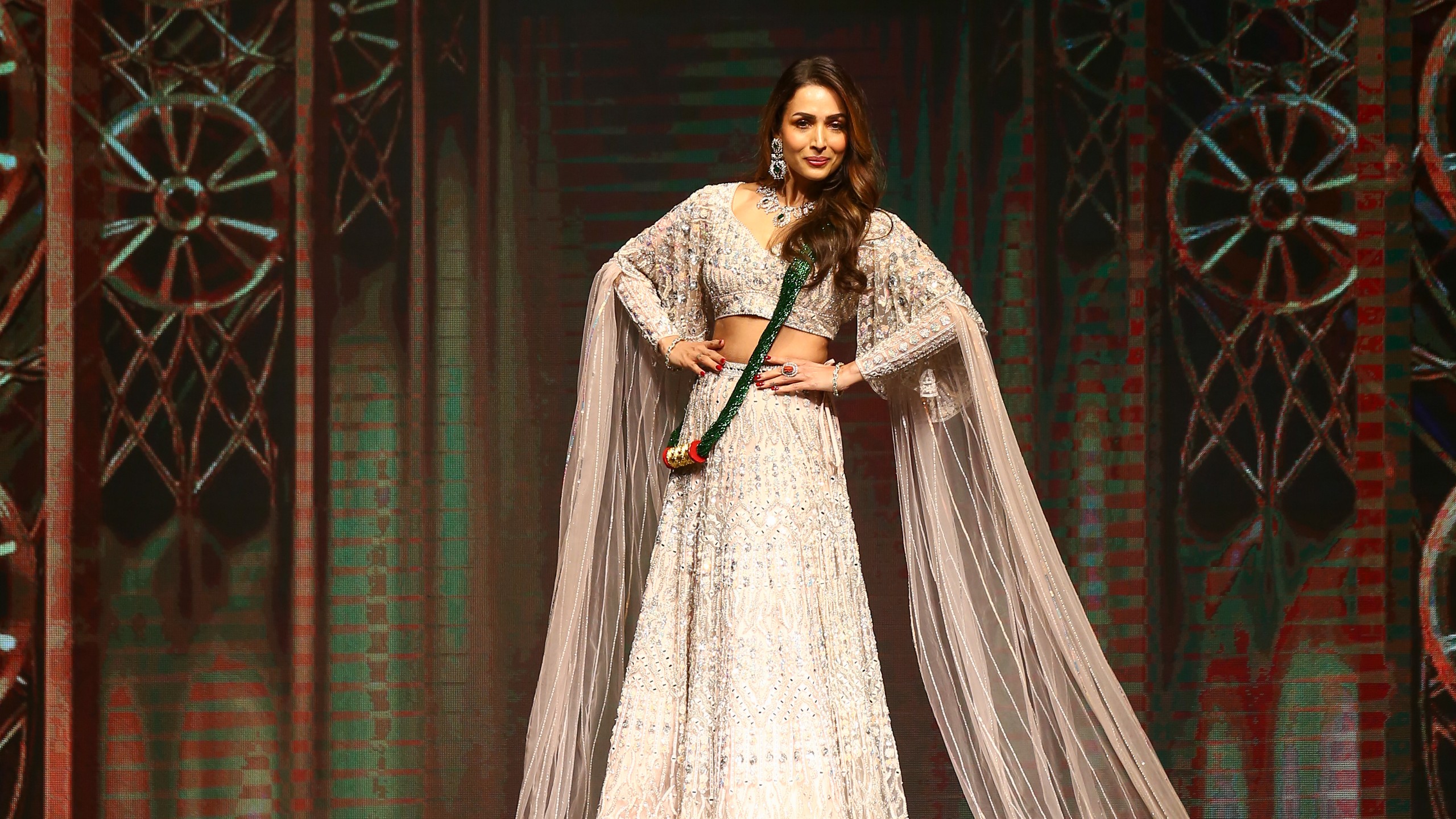 Malaika Arora exudes elegance as she walks ramp in ivory lehenga