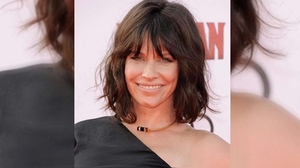 Evangeline Lilly longs to fondle King Charles ear lobes