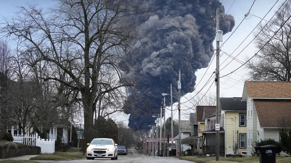 Crews release toxic chemicals from derailed tankers in Ohio