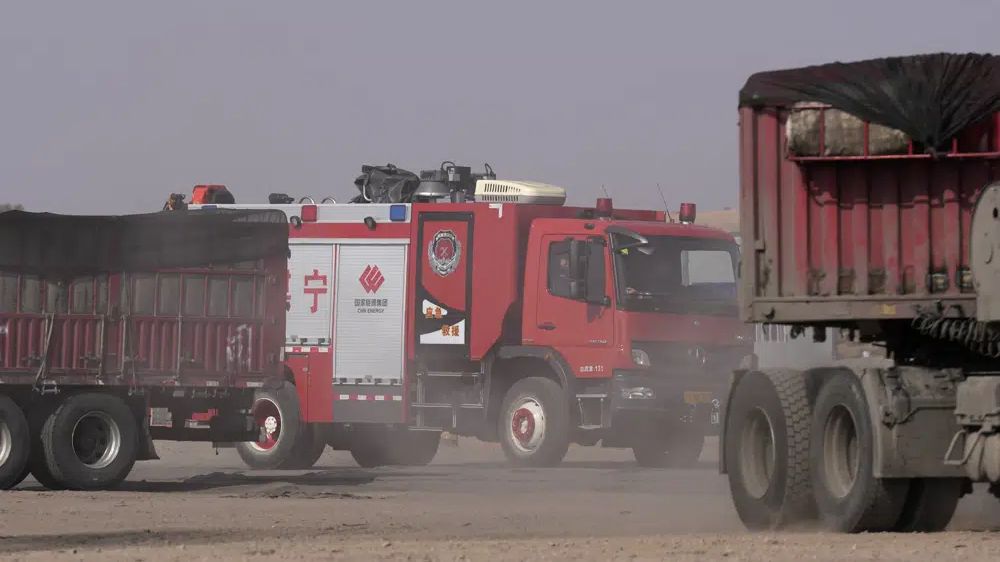 Workers dig by layers in search for 47 missing at China mine