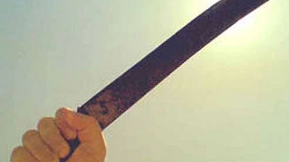 Youth cuts cake with machete; probe on