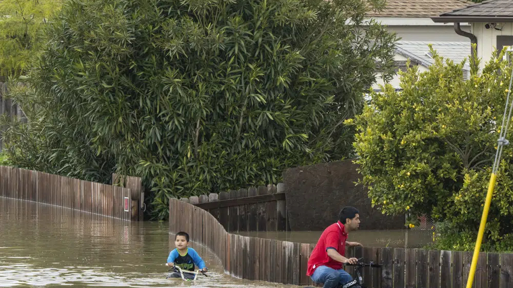 Storm breaches California river’s levee, thousands evacuate
