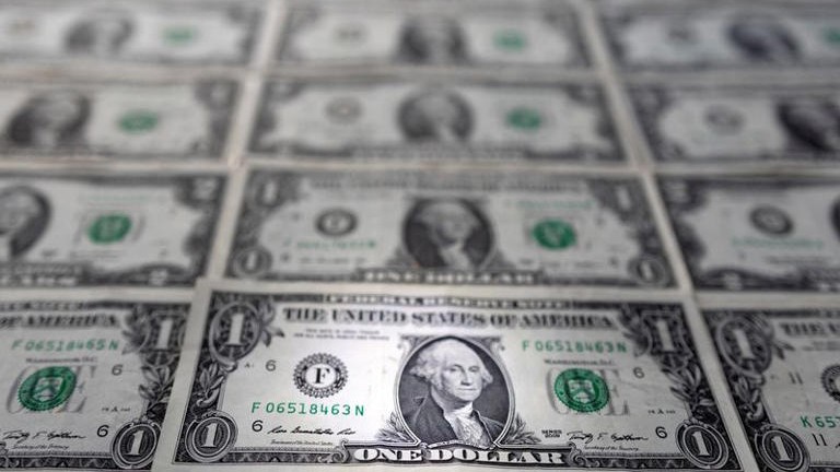Dollar to log quarterly drop as rate hike bets recede