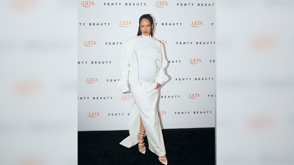 Rihanna shows her baby bump in all-white outfit, Paris Hilton sends love